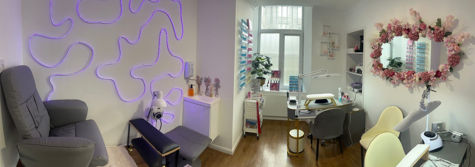 The Sunsmile treatment room — purple neon wall art, dimmed lighting, the pressotherapy chair waiting